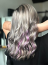 Woman with silver hair and purple strands