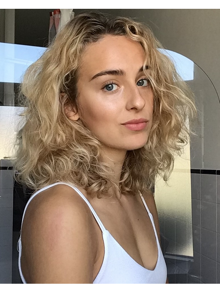Model with dishevelled curly hair