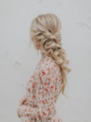 Woman with blonde braided prom hair