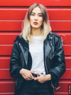 Woman with ombré hair wearing leather jacket
