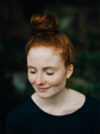 Woman with red hair in a bun