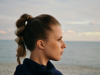 Woman with dark blonde braided hair