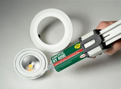 Applying a selected structural adhesive to a bulb housing