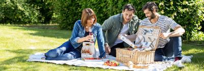 A group of friends preparing their picnic lunch