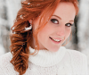 Red-haired woman with snow in her hair