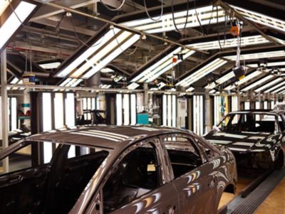 Audi vehicle bodies on the production line during BONDERITE two-step process surface treatment