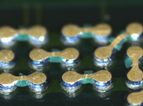 Closeup photo of BGA solder balls with epoxy flux underfill for package on package electronic device assembly