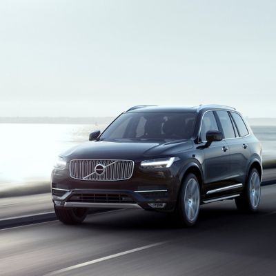 Black Volvo XC 90 sport utility vehicle driving on the highway