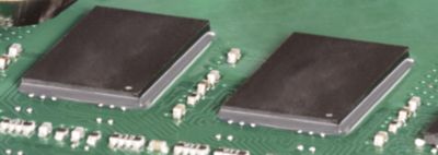 Photo of components on green pcb utilizing board level underfill material