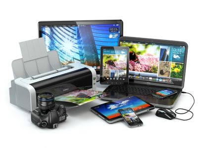 Photo of a variety of consumer electronic devices including printer,tablet,cell phone,camera,laptop,computer shutterstock ID 217080976