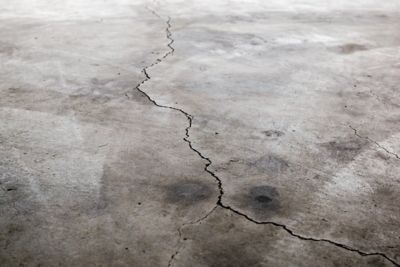 A prominent crack in a concrete floor