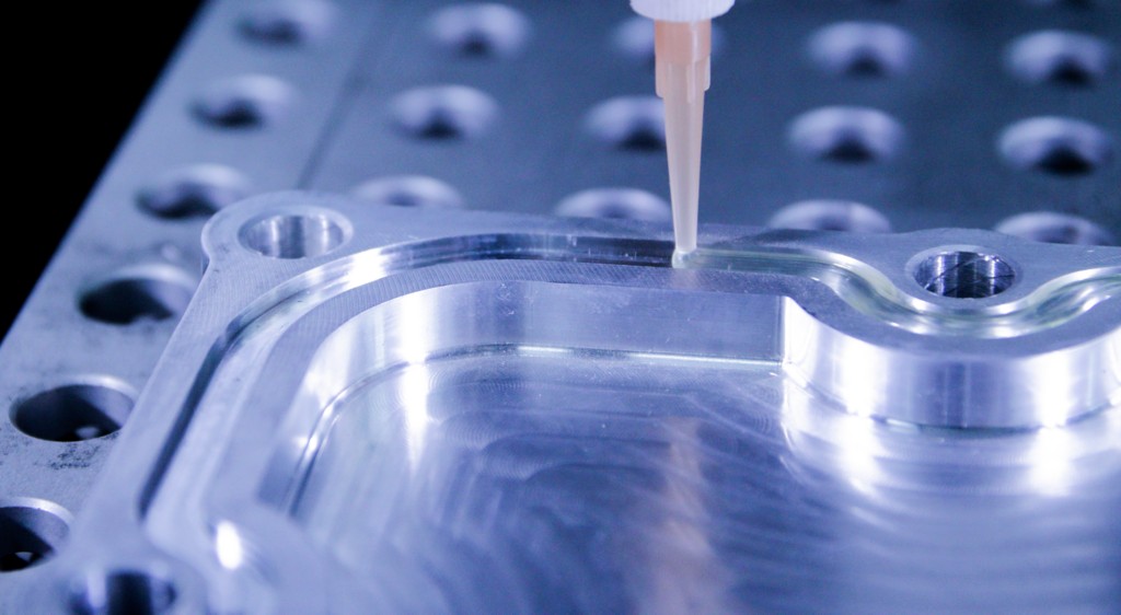 Automated robotic cured-in-place gasket application on metal component