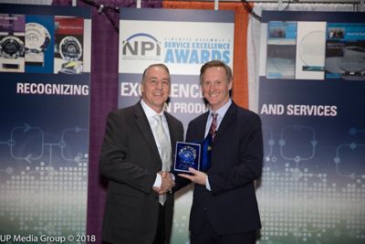Photo of doug dixon accepting trophy in circuits assembly magazine's annual npi excellence award contest recognizing henkel adhesive electronics group for its broad innovation portfolio March 2018