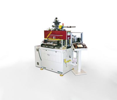 Photo of red and white PRECO flat bed automated die cutting machine