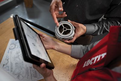 man looking at loctite products on a shelf