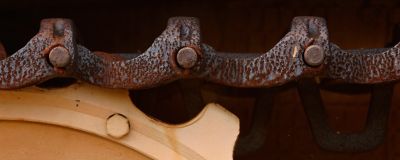 Extreme close up of rusted heavy duty construction machinery