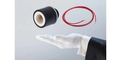 The hand of a butler underneath an electronic component and bit of red wire