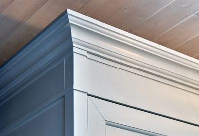 Crown moldings on top of an elegant cabinet