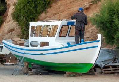 A man repairing a boat