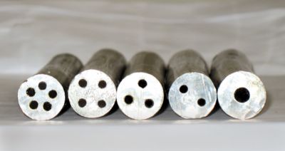 Magnified photo of a variety of cored solder wires side by side cross section view