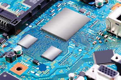 Photo of blue electronic circuit board graphically enhanced with package level EMI shielding on three components base image is shutterstock ID 333379685