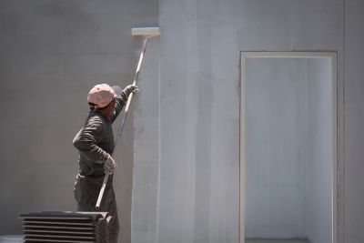 Person using wall primer