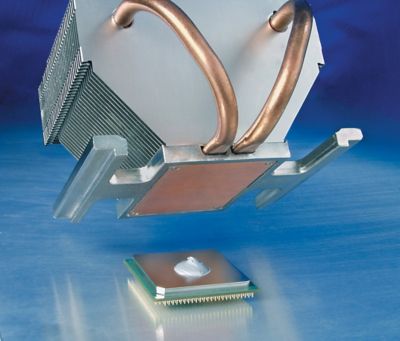 Photo of application of bergquist phase change thermal interface material to chip surface represents alternative to thermal grease