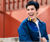 Woman with short black hair laughing