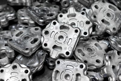 Pile of aluminum automotive parts, casting process in the automotive industry factory