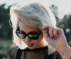 Model with a white bob hairstyle and sunglasses