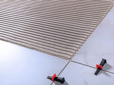 HOW TO APPLY TILE ADHESIVE PROPERLY