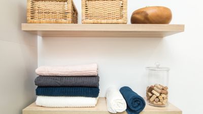 shelves with towels and small baskets