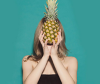 Woman with pineapple and soft tousled hairstyle